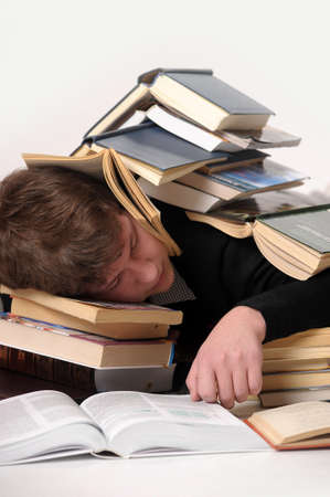 student sleeping among the booksの写真素材