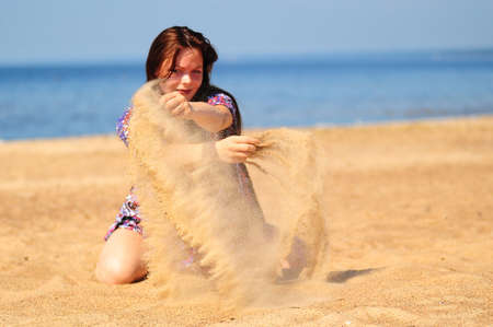 poured the sand out of the handsの写真素材