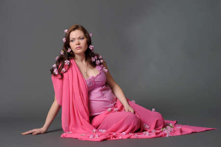 beautiful pregnant woman in the pinkの写真素材