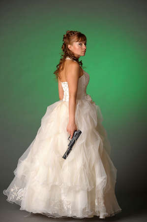 beautiful bride with a gunの写真素材