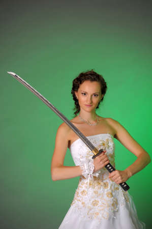 bride with a sword in his hand の写真素材