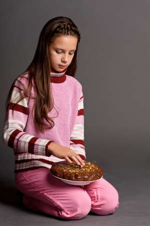 teen girl with cake in hand