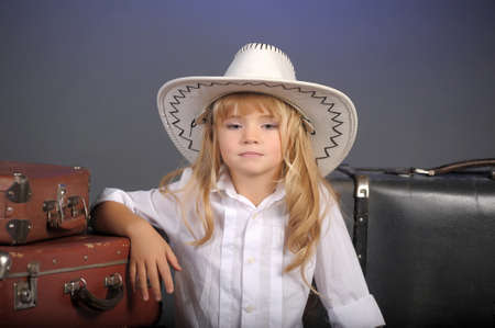 little girl in a white cowboy hat