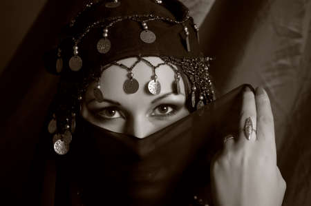 Middle eastern culture: belly dancer with traditional veil の写真素材