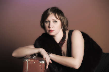 The woman with the old  Suitcaseの写真素材