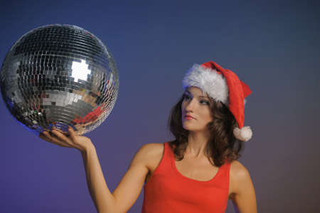 Santa-rina holding a disco ballの写真素材