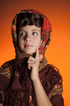 Girl with a scythe in Russian shawlの写真素材