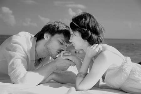 Young romantic couple on the beach, sepia toneの写真素材
