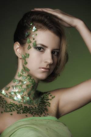 the beautiful girl with a creative make-up with spanglesの写真素材