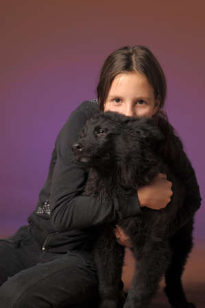 teen girl with black dogの写真素材