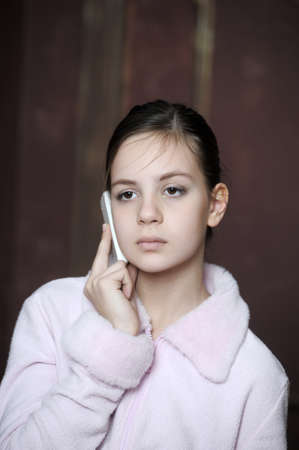 Teen talking on the phoneの写真素材