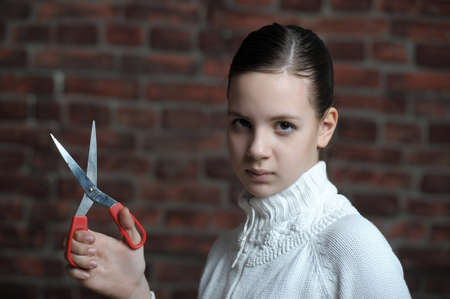 girl with scissors in handの写真素材