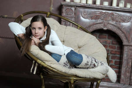 Young beautiful red hair teen girl in deep thought の写真素材