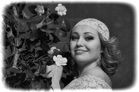 Retro portrait of Pretty woman with roses 
