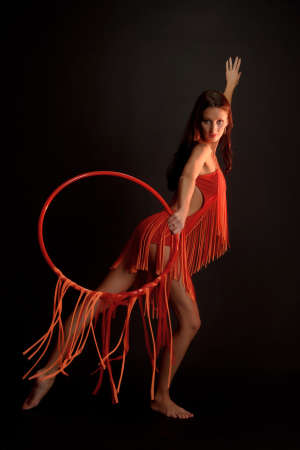 gymnast in red with a hoop