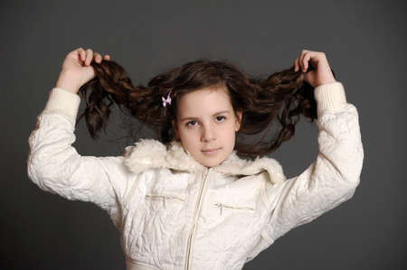 Beautiful teen girl with long curly hairs