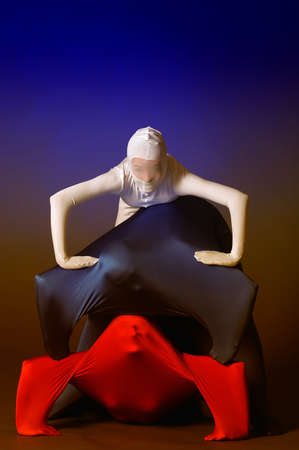 three figures in white, red and blueの写真素材