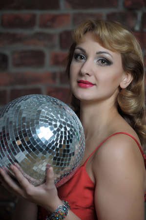 beautiful young woman with disco ball