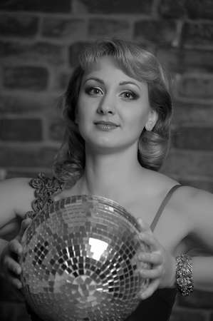 beautiful young woman with disco ball