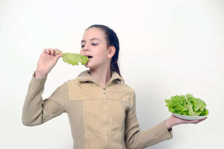Young beauty girl with green lettuce  