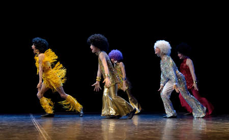 Dance group performs on stage