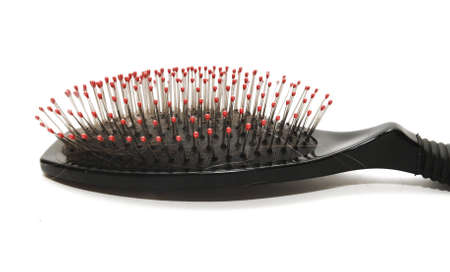 Close-up of a hairbrush with lost hair in itの写真素材