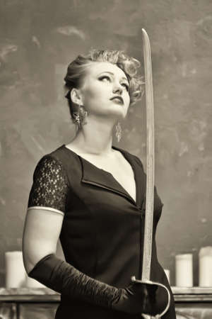 blonde with a sabre in hands