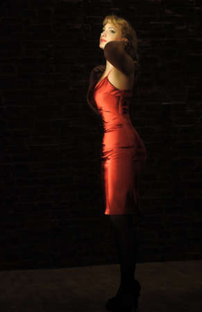  Beautiful pretty woman posing in red dress の写真素材