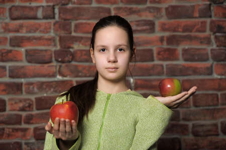 Teen girl with  apples