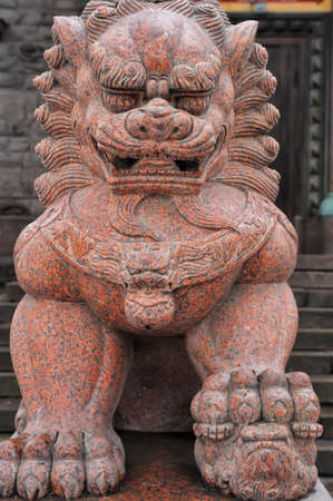 Lion sculpture as a gard in front of Buddhist Temple Gunzechojnej, Saint-Petersburg, Russia の写真素材