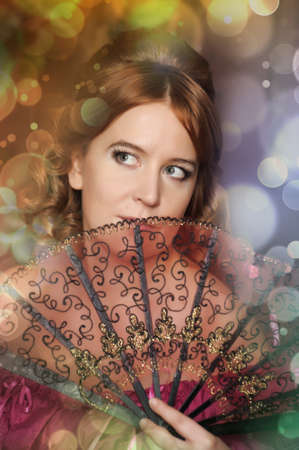 The romantic lady of the Victorian era with a fan