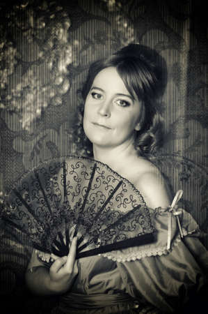 The romantic lady of the Victorian era with a fan