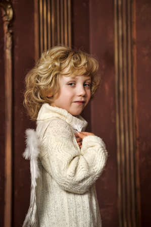 the blond boy with wings of an angelの写真素材