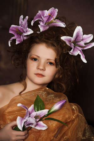 girl with lilac lilies in her hairの写真素材