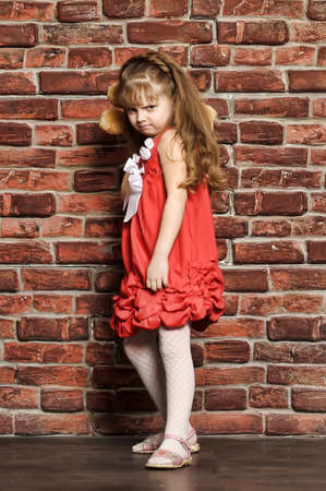 the little girl throws a toy bearの写真素材