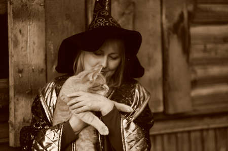 Witch with a cat in her armsの写真素材