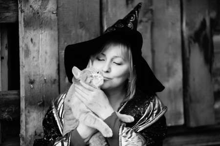 Witch with a cat in her armsの写真素材