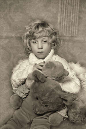 Little cute boy with his teddy bearの写真素材