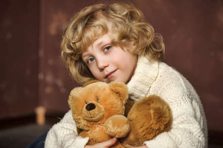 Little cute boy with his teddy bearsの写真素材