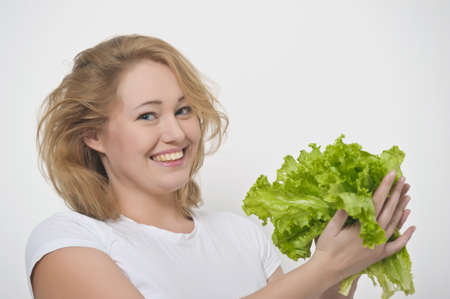 Girl and salad leafsの写真素材