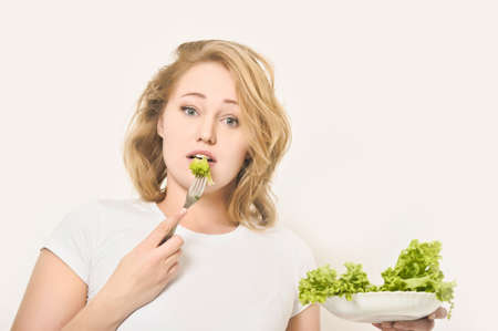 Girl and salad leafsの写真素材