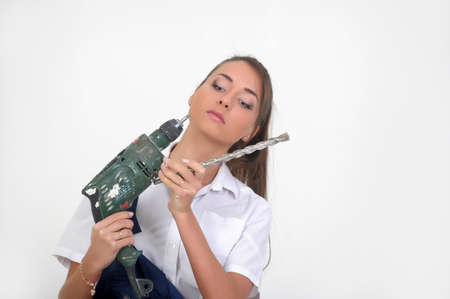 Beautiful girl with a drillの写真素材