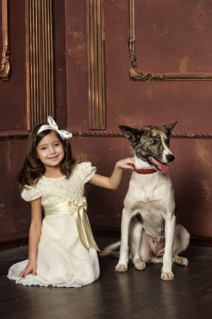 Portrait of a little girl with dogの写真素材