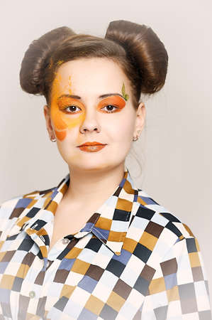 the girl with a bright make-up wearing spectacles