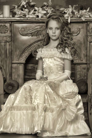 Girl in a smart white dressの写真素材