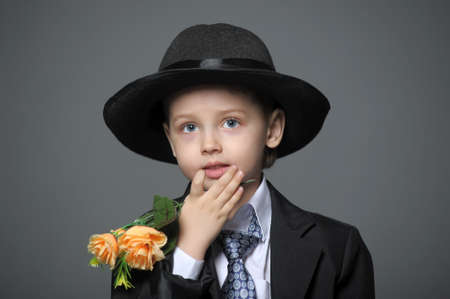 Boy in costume with flowersの写真素材