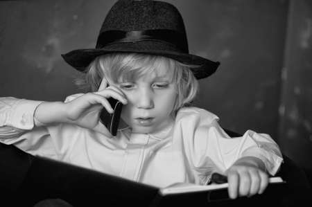 little boy in the role of a businessmanの写真素材
