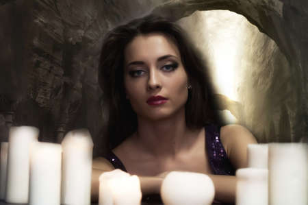 the beautiful brunette with candlesの写真素材