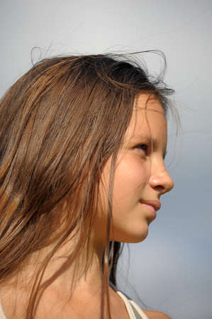 The girl the teenager with long beautiful hair 