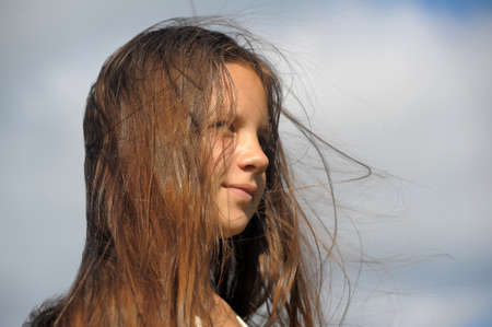 The girl the teenager with long beautiful hair 